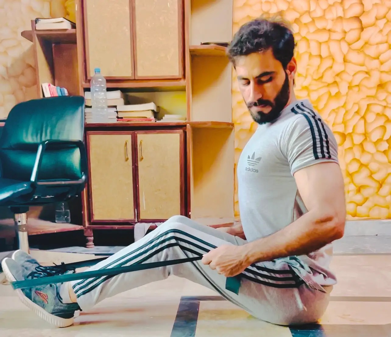 seated resistance band row exercise, focusing on strengthening the upper back and improving posture